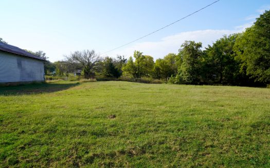 No Reserve Large Commercial Shop, Home, and Vacant Lots Auction